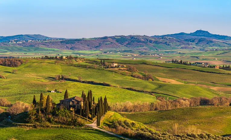 Scenic rolling hills and cypress trees in Tuscany