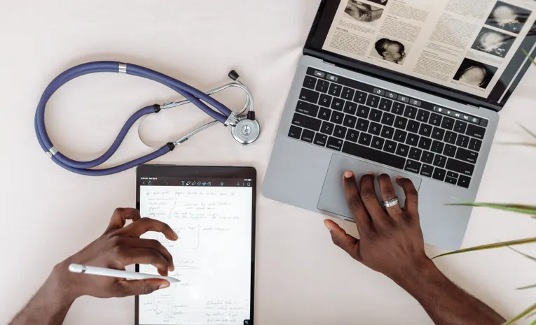 Person researching health information on a laptop
