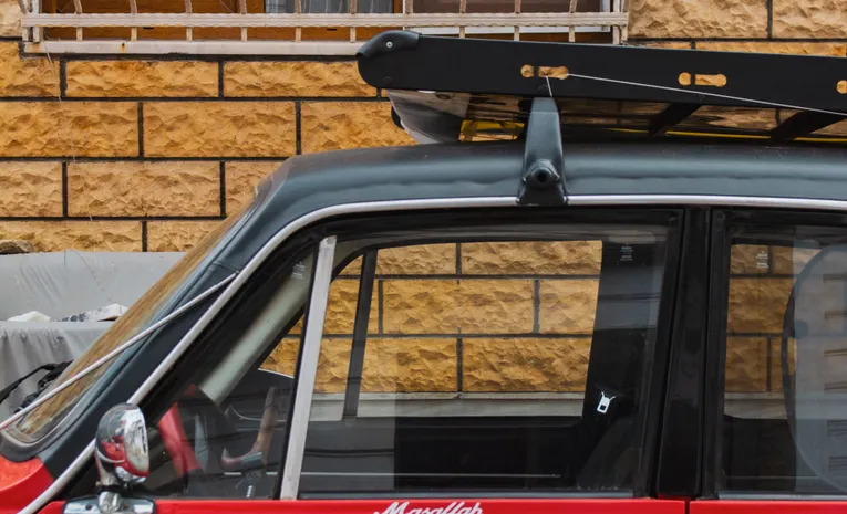 Car with a roof rack fitted on top