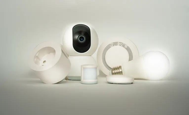 Collection of smart home devices including camera and light bulb