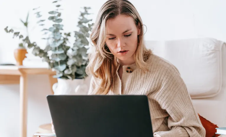 Freelancer working on a laptop from home