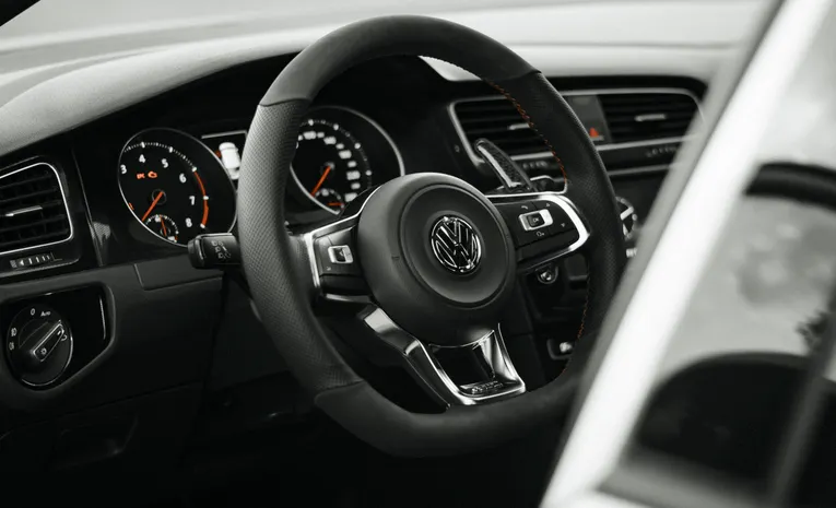 Modern car dashboard and steering wheel interior