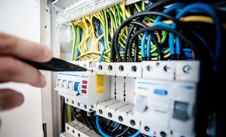 Electrician working on a circuit breaker panel