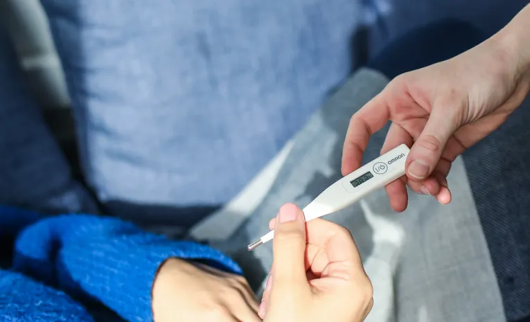 Person resting at home with flu symptoms