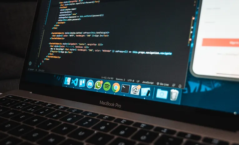 Laptop screen displaying web development code