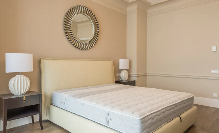 Bedroom with a clean, made mattress